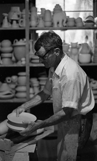 Peter Anderson Selecting Bisque Ware to Glaze- 1975